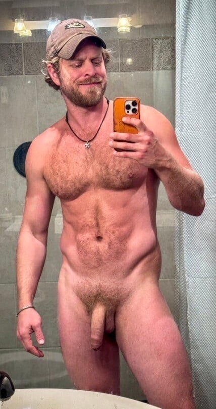 Photo by Nickplus33 with the username @Nickplus33, who is a verified user,  February 28, 2024 at 3:52 AM and the text says '#beard #caps #chain #uncut  #bush #dilf #loganstevens #obsession #selfie #blondes'