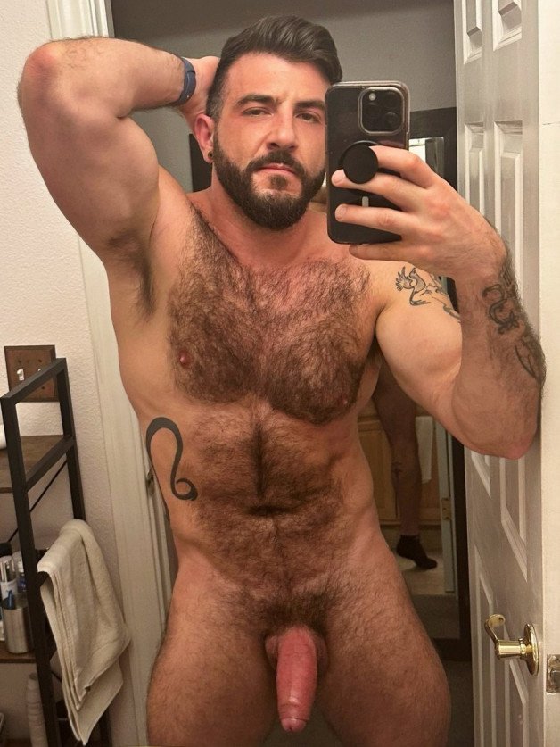 Photo by Nickplus33 with the username @Nickplus33, who is a verified user,  March 13, 2024 at 3:32 AM and the text says '#selfie #hairy #dilf #beard #thickdick #uncut  #fatcock #trimmed  #ink'