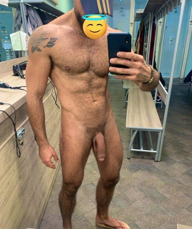 Photo by Nickplus33 with the username @Nickplus33, who is a verified user,  April 21, 2024 at 3:45 AM and the text says '#caps #selfie #lockerroom #toned #hairy #trimmed  #hung #beard #uncut  #longdick #ink #chain'
