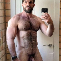 Photo by Nickplus33 with the username @Nickplus33, who is a verified user,  February 26, 2024 at 2:59 AM and the text says '#beard #muscled #dilf #selfie #hairy #bush #uncut'