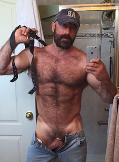 Photo by Nickplus33 with the username @Nickplus33, who is a verified user,  February 19, 2024 at 3:23 AM and the text says '#caps #daddy #hairy #toned #cockring #reveal #hung #thickdick #schlong  #beard #selfie'