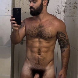 Photo by Nickplus33 with the username @Nickplus33, who is a verified user,  May 5, 2024 at 2:50 AM and the text says '#dilf #beard #hairy #hairychest #bush #hung #selfie #toned  #happytrail'