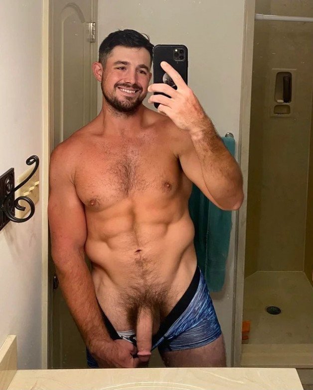 Photo by Nickplus33 with the username @Nickplus33, who is a verified user,  May 16, 2024 at 3:40 AM and the text says '#selfie #hung #longdick #youngdilf #otter  #beard #toned #happytrail #reveal'