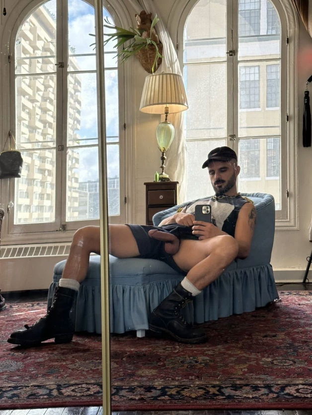 Photo by Nickplus33 with the username @Nickplus33, who is a verified user,  March 21, 2024 at 2:37 AM and the text says '#manspread  #caps #otter  #hung #selfie #beard #selfie'