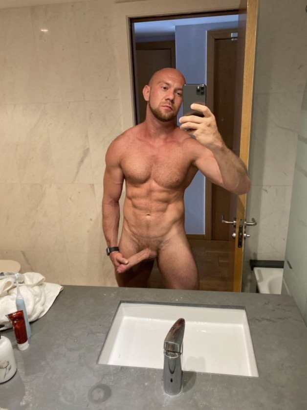 Photo by Nickplus33 with the username @Nickplus33, who is a verified user,  April 27, 2024 at 2:17 AM and the text says '#selfie #bald #trimmed  #scruff  #dimple #muscled #dilf #hung #longdick #schlong  #trimmed'