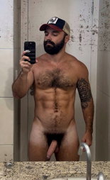 Photo by Nickplus33 with the username @Nickplus33, who is a verified user,  May 25, 2024 at 3:16 AM and the text says '#beard #caps #selfie #hairychest #happytrail #thickbush #uncut  #longdick #veiny #dilf'