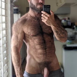 Photo by Nickplus33 with the username @Nickplus33, who is a verified user,  April 10, 2024 at 1:54 AM and the text says '#selfie #muscled #hairy #youngdilf #dilf #beard #chain  #bush #reveal'