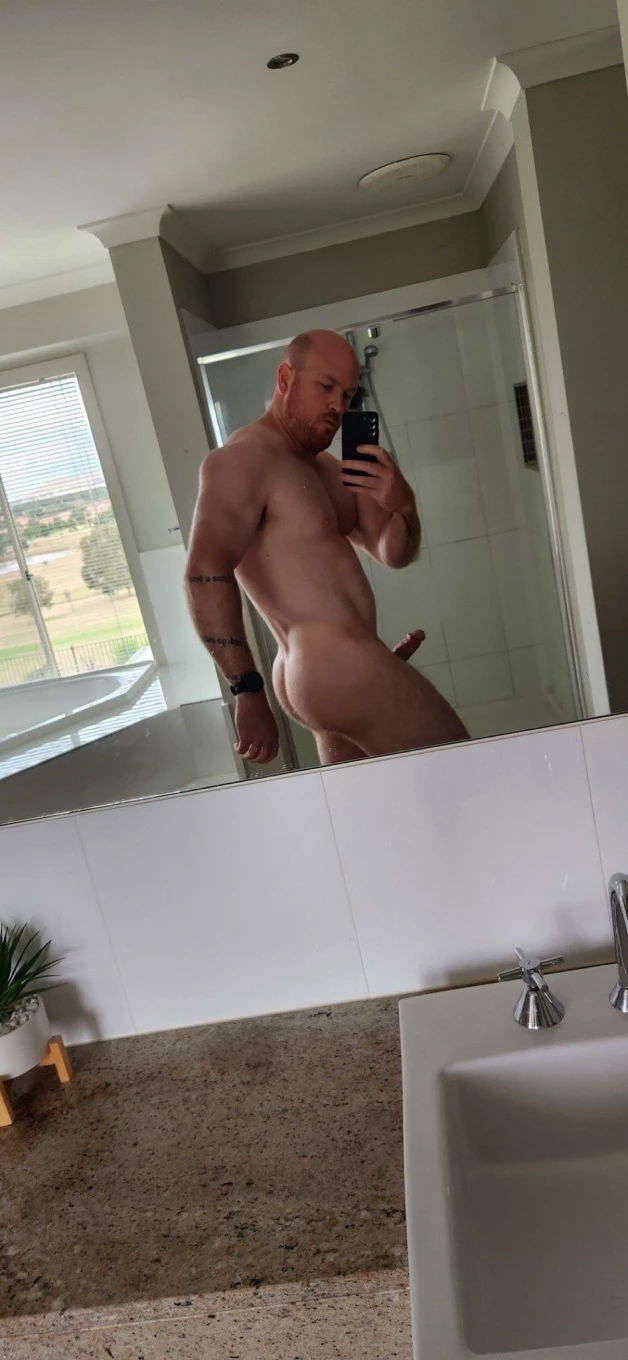 Photo by Nickplus33 with the username @Nickplus33, who is a verified user,  May 10, 2024 at 6:06 AM and the text says '#beefy #toned #bald #dilf #daddy #shower #spear  #selfie #ginger'