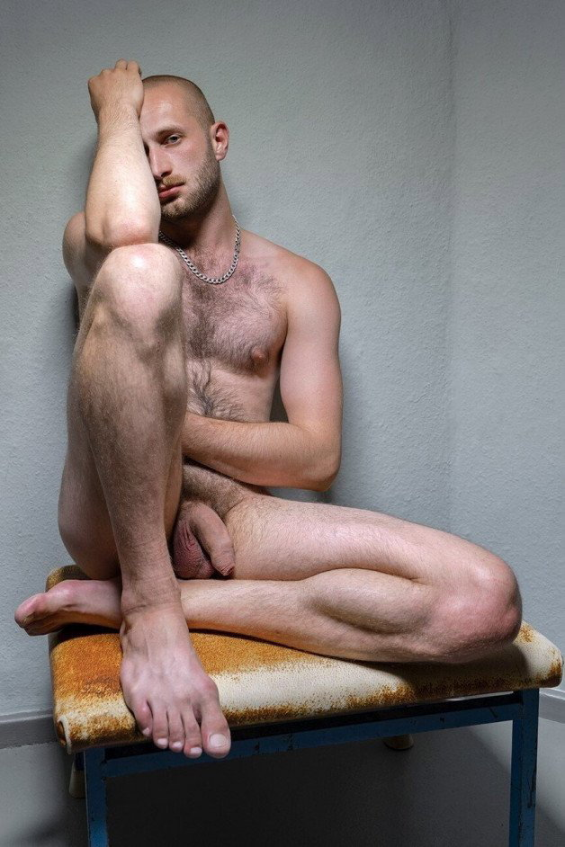Photo by Nickplus33 with the username @Nickplus33, who is a verified user,  February 24, 2024 at 2:19 AM and the text says '#otter  #manspread  #hairy #uncut  #chain #bald #dimple #scruff'