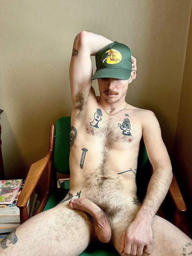 Photo by Nickplus33 with the username @Nickplus33, who is a verified user,  February 3, 2024 at 5:50 AM and the text says '#otter #stache #chain #ink #bush #longdick #caps #redneck'