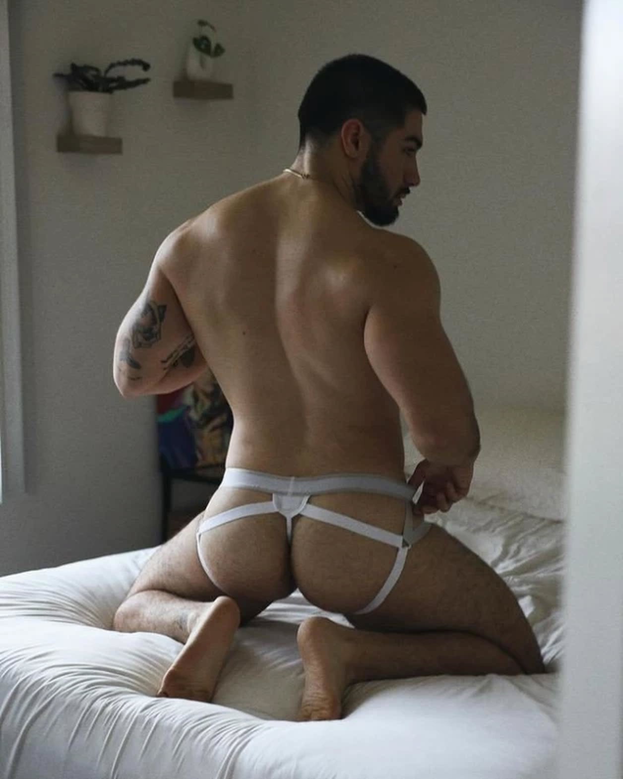 Photo by Nickplus33 with the username @Nickplus33, who is a verified user,  March 30, 2024 at 7:15 AM and the text says '#jockstrap #toned #beard #ink #muscled #butt'