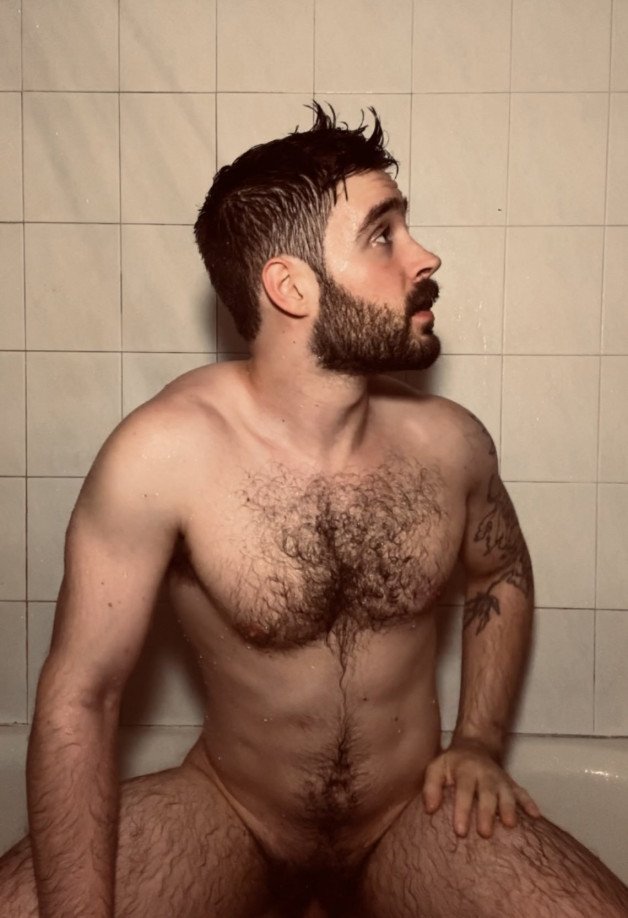 Photo by Nickplus33 with the username @Nickplus33, who is a verified user,  June 30, 2024 at 3:08 AM and the text says '#Forest #obsession #otter    #hairychest #happytrail #bush #beard #hairy #manspread'