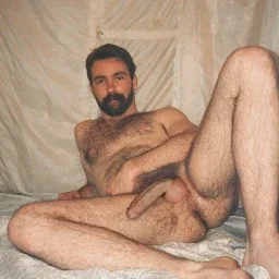 Photo by Nickplus33 with the username @Nickplus33, who is a verified user,  April 13, 2024 at 3:23 AM and the text says '#manspread  #dilf #hairy #beard #longdick #thickbush #hairyhole'