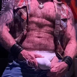 Photo by Nickplus33 with the username @Nickplus33, who is a verified user,  May 2, 2024 at 3:05 AM and the text says '#ink #bulge #chain #hairy #beefy #jockstrap #daddy #cruising'