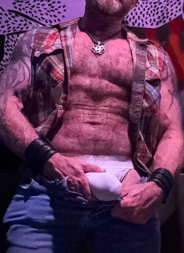 Photo by Nickplus33 with the username @Nickplus33, who is a verified user,  May 2, 2024 at 3:05 AM and the text says '#ink #bulge #chain #hairy #beefy #jockstrap #daddy #cruising'