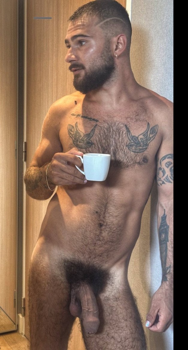 Photo by Nickplus33 with the username @Nickplus33, who is a verified user,  June 1, 2024 at 3:47 AM and the text says '#dilf #coffee #toned #hung #thickbush #veiny #hairychest #beard'