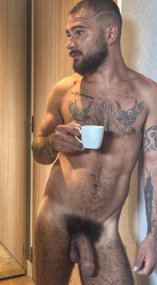 Photo by Nickplus33 with the username @Nickplus33, who is a verified user,  March 8, 2024 at 6:22 AM and the text says '#beard #otter  #youngdilf #toned #coffee #thickbush #hung'