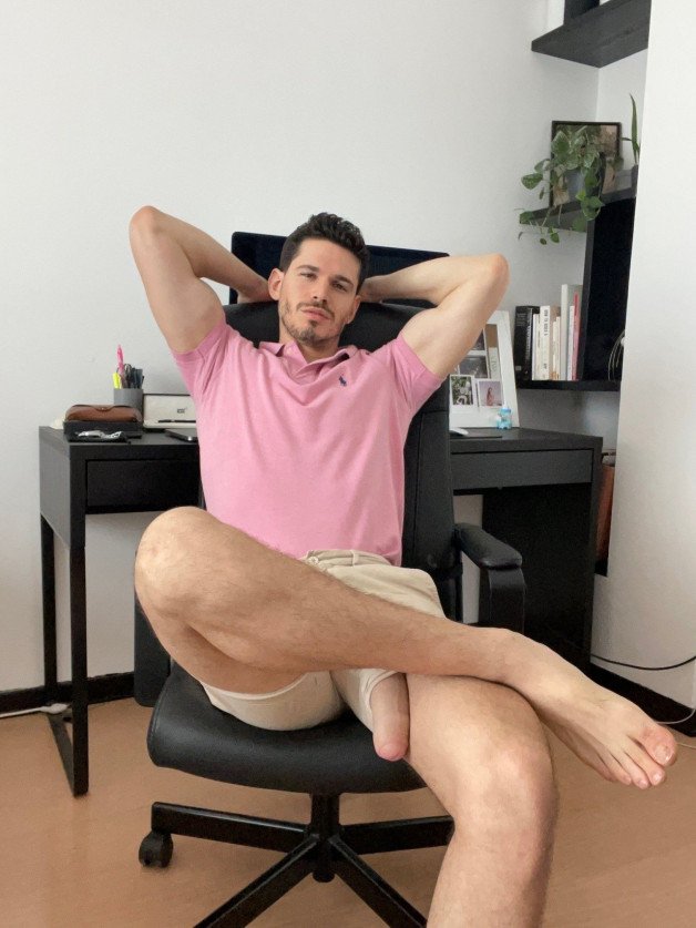 Photo by Nickplus33 with the username @Nickplus33, who is a verified user,  April 20, 2024 at 2:34 AM and the text says '#homeoffice #manspread  #hung #reveal #monstercock #massivecock #uncut  #schlong  #longdick #otter  #youngdilf'