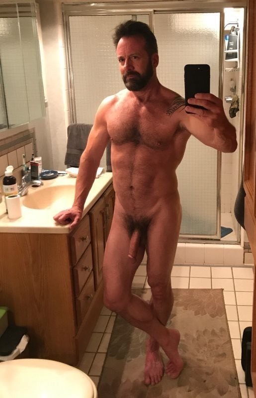 Photo by Nickplus33 with the username @Nickplus33, who is a verified user,  March 11, 2024 at 2:56 AM and the text says '#toned #hairy #beard #bush #longdick #selfie #daddy #schlong'