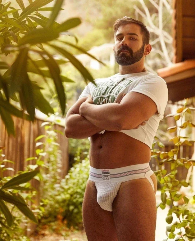 Photo by Nickplus33 with the username @Nickplus33, who is a verified user,  March 16, 2024 at 4:30 AM and the text says '#beefy #jockstrap #youngdilf #beard #dilf #bulge'