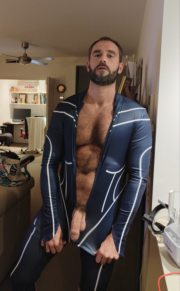 Photo by Nickplus33 with the username @Nickplus33, who is a verified user,  April 29, 2024 at 2:40 AM and the text says '#dilf #toned #beard #hairy #hairychest #trimmed  #hung #uncut  #trimmed'