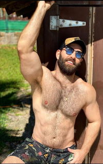 Photo by Nickplus33 with the username @Nickplus33, who is a verified user,  April 30, 2024 at 1:10 AM and the text says '#dilf #shades #beard #caps #outdoors #hairy #hairychest #toned'