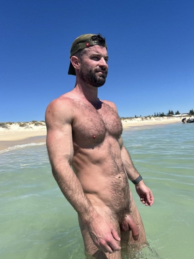 Photo by Nickplus33 with the username @Nickplus33, who is a verified user,  June 30, 2024 at 3:17 AM and the text says '#beard #hairy #caps #bush #outdoors #beach #dilf #uncut'