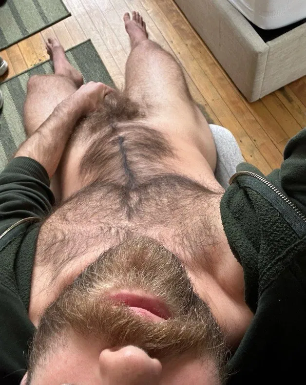 Photo by Nickplus33 with the username @Nickplus33, who is a verified user,  July 3, 2024 at 1:52 AM and the text says '#beard #hairy #thickbush #dilf #toned'