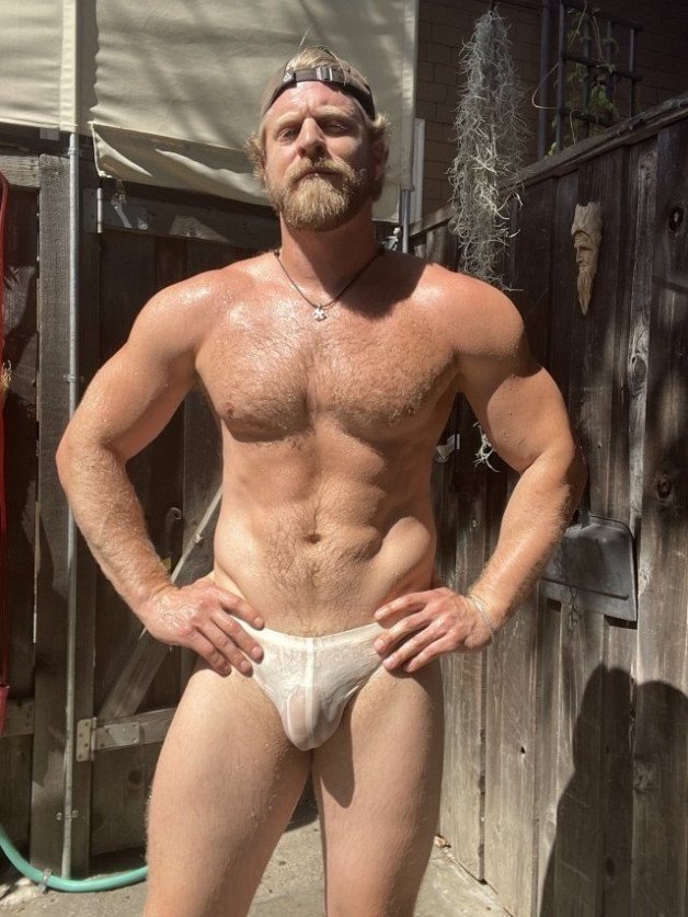 Photo by Nickplus33 with the username @Nickplus33, who is a verified user,  April 26, 2024 at 2:04 AM and the text says '#toned #blondes #hairy #caps #loganstevens #obsession #dilf #chain #hairychest #bulge'