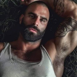 Photo by Nickplus33 with the username @Nickplus33, who is a verified user,  May 2, 2024 at 3:05 AM and the text says '#beard #dilf #hairy #muscled #ink'