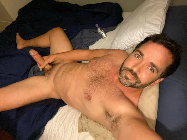 Photo by Nickplus33 with the username @Nickplus33, who is a verified user,  April 13, 2024 at 3:17 AM and the text says '#dilf #manspread  #hung #longdick #dilf #beard #trimmed'
