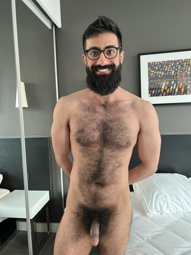 Photo by Nickplus33 with the username @Nickplus33, who is a verified user,  July 11, 2024 at 2:05 AM and the text says '#specs #beard #toned #thickbush #hairychest #otter'