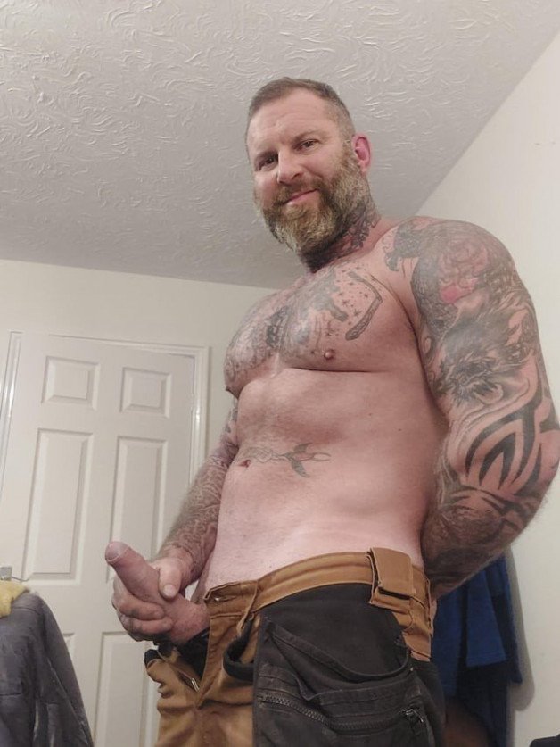 Photo by Nickplus33 with the username @Nickplus33, who is a verified user,  October 18, 2023 at 3:23 AM and the text says '#dilf #ink #beard #hairy #hung #uncut #beefy #ink #tradie'