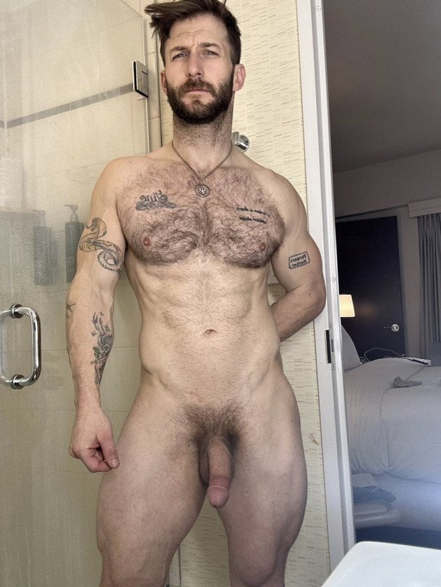 Photo by Nickplus33 with the username @Nickplus33, who is a verified user,  June 23, 2024 at 3:16 AM and the text says '#nicolasryder #obsession #youngdilf #hairy #dilf #beard #chain #scruff  #ink #hairychest #trimmed  #bush'