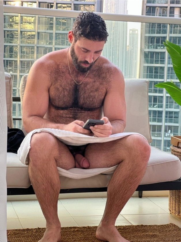 Photo by Nickplus33 with the username @Nickplus33, who is a verified user,  February 27, 2024 at 2:22 AM and the text says '#hairy #dilf #chain #beard #manspread  #hung #thickdick #thickbush'