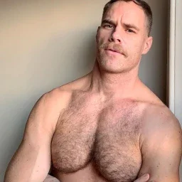 Photo by Nickplus33 with the username @Nickplus33, who is a verified user,  April 2, 2024 at 3:34 AM and the text says '#dilf #hairychest #stache #muscled'