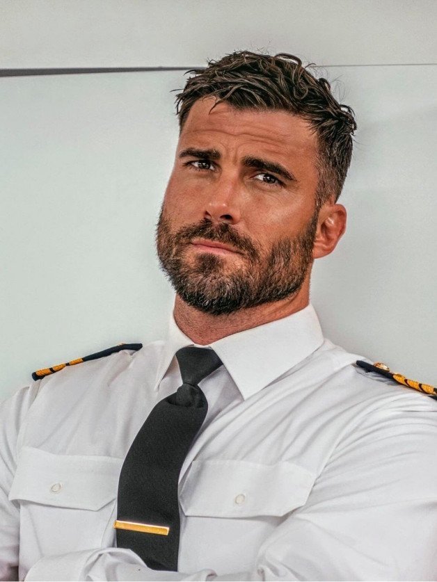 Photo by Nickplus33 with the username @Nickplus33, who is a verified user,  April 29, 2024 at 2:35 AM and the text says '#beard #dilf #uniform'