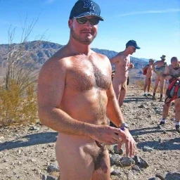 Photo by Nickplus33 with the username @Nickplus33, who is a verified user,  May 10, 2024 at 3:55 AM and the text says '#outdoors #dilf #beard #hairy #beefy #caps #shades #thickbush #scruff'