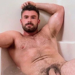 Photo by Nickplus33 with the username @Nickplus33, who is a verified user,  April 14, 2024 at 4:07 AM and the text says '#beard #hairychest #hung #uncut  #manspread  #bush #trimmed  #youngdilf #hairy'