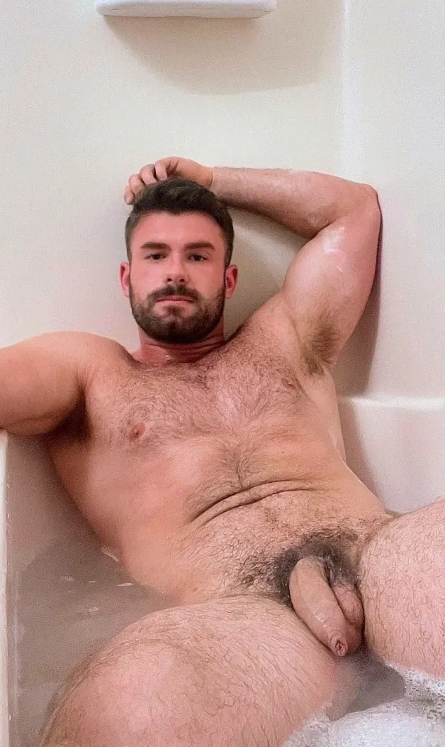 Photo by Nickplus33 with the username @Nickplus33, who is a verified user,  April 14, 2024 at 4:07 AM and the text says '#beard #hairychest #hung #uncut  #manspread  #bush #trimmed  #youngdilf #hairy'