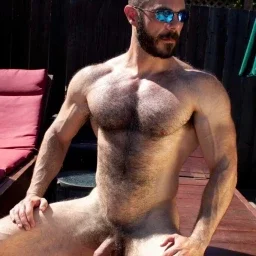 Photo by Nickplus33 with the username @Nickplus33, who is a verified user,  March 18, 2024 at 3:16 AM and the text says '#muscled #hairy #thickbush #manspread  #band #shades #outdoors #dilf #thickdick #uncut'