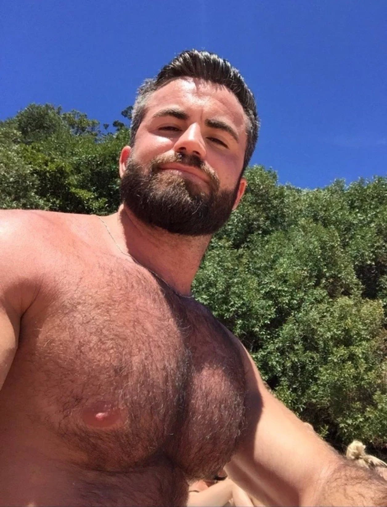 Photo by Nickplus33 with the username @Nickplus33, who is a verified user,  March 22, 2024 at 2:46 AM and the text says '#beard #hairy #dilf #outdoors #youngdilf #bear'