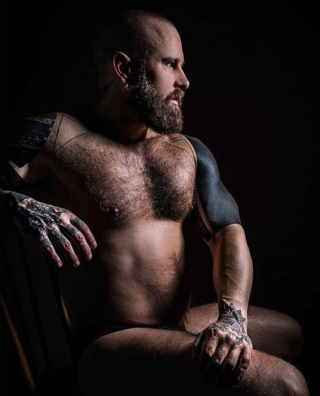 Photo by Nickplus33 with the username @Nickplus33, who is a verified user,  November 1, 2023 at 5:14 AM and the text says '#benbrown #obsession #beefy #beard #hairy #ink #god'