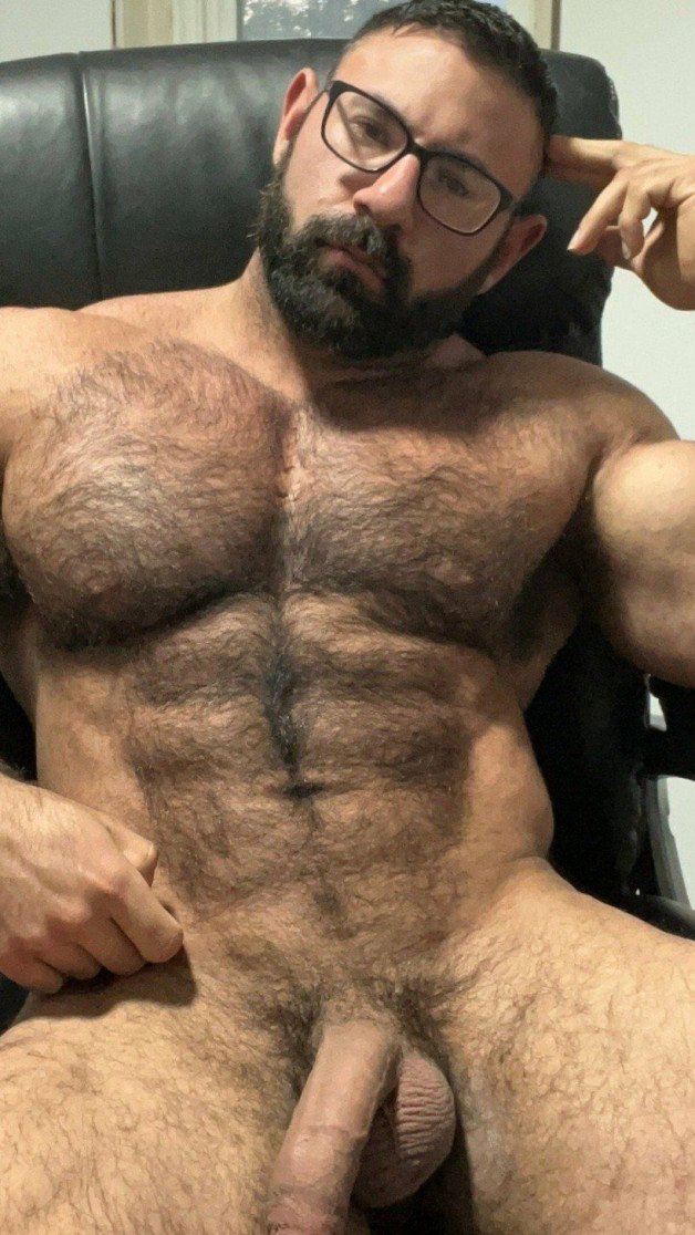 Photo by Nickplus33 with the username @Nickplus33, who is a verified user,  January 28, 2024 at 5:02 AM and the text says '#beard #specs #hairy #muscled #dilf'