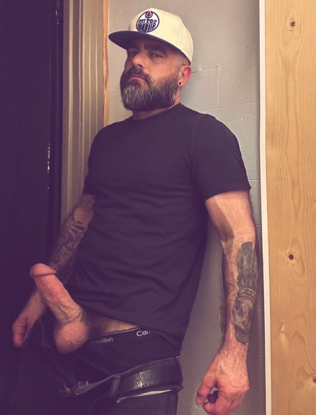 Photo by Nickplus33 with the username @Nickplus33, who is a verified user,  June 16, 2024 at 2:53 AM and the text says '#caps #beard #dilf #ink #massivecock #thickdick #fatcock #spear #reveal #monstercock #balls'