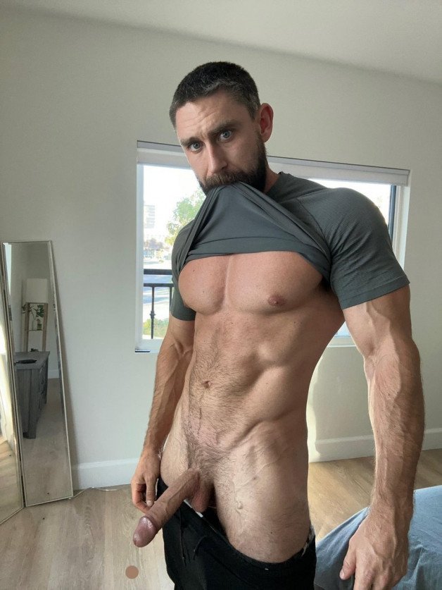 Photo by Nickplus33 with the username @Nickplus33, who is a verified user, posted on January 5, 2024 and the text says '#muscled #hung #trimmed #beard #longdick'