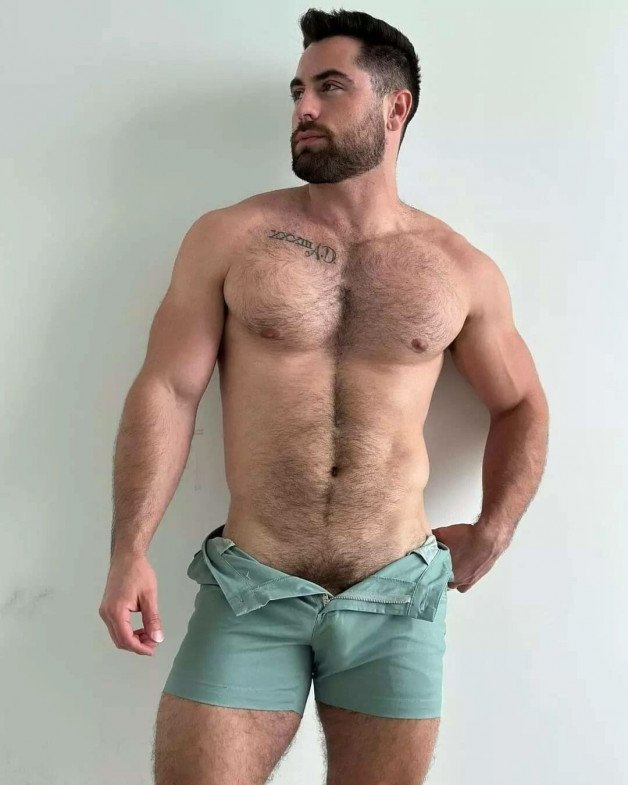 Photo by Nickplus33 with the username @Nickplus33, who is a verified user,  April 25, 2024 at 2:29 AM and the text says '#ruggeryvaldivia #obsession #hairy #beard #toned #trimmed  #bulge #bush #happytrail #youngdilf'