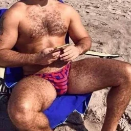 Photo by Nickplus33 with the username @Nickplus33, who is a verified user,  May 6, 2024 at 4:00 AM and the text says '#beefy #outdoors #dilf #hairy #manspread  #bulge #beach'