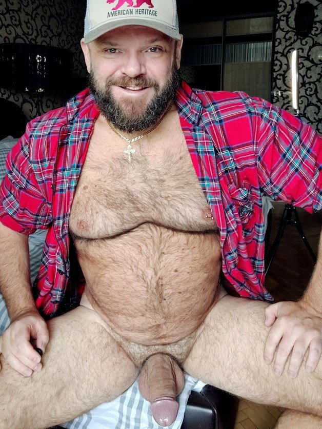 Photo by Nickplus33 with the username @Nickplus33, who is a verified user,  May 22, 2024 at 1:34 AM and the text says '#caps #daddy #beefy #manspread  #hairy #bear #beard #chain #thickdick'