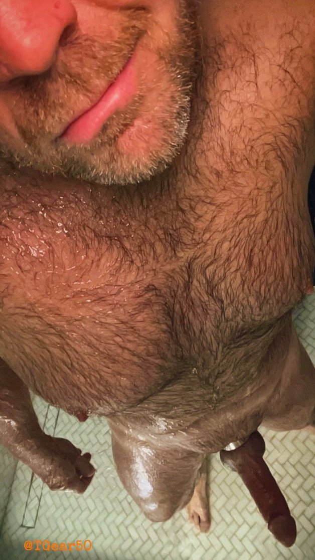 Photo by Nickplus33 with the username @Nickplus33, who is a verified user,  March 15, 2024 at 2:37 AM and the text says '#shower #dilf #hairy #hung #cockring #longdick #massivecock #beard #scruff'